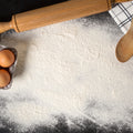 Baking powder on counter with bread roller