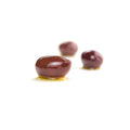 Pitted calamata olives on a white background