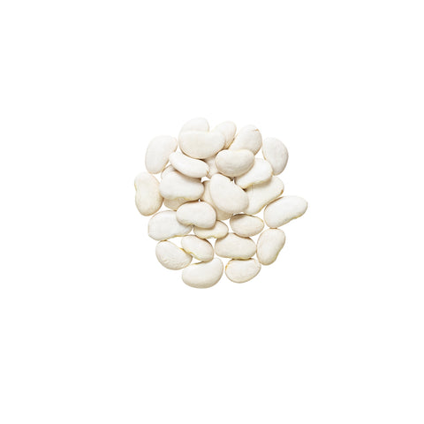 Pile of organic baby lima beans on a white background