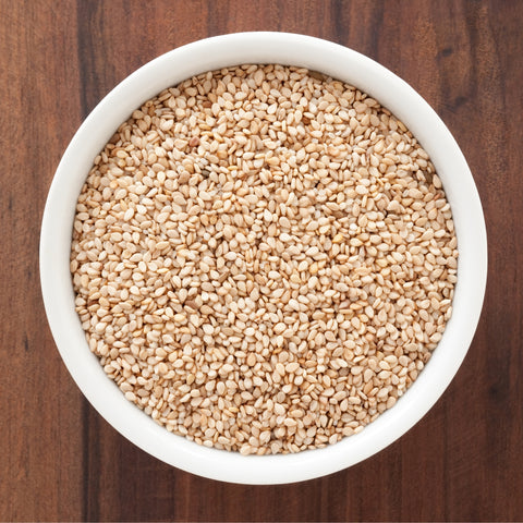 Bowl of organic whole brown sesame seeds