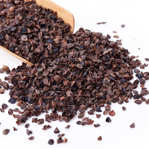 Scoop of organic whole buckwheat