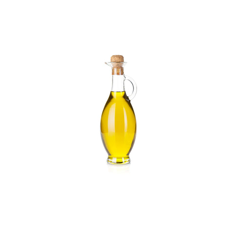 Glass bottle of organic canola oil on white background