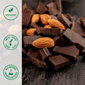Close-up of organic dark chocolate next to almonds