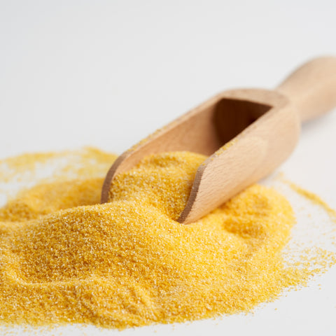 Scoop of organic yellow corn meal