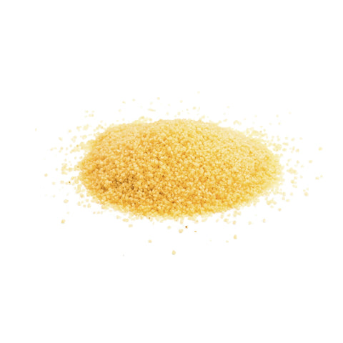 Organic couscous granules made from durum wheat on white background