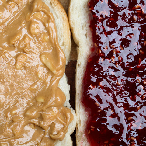 Organic crunchy peanut butter spread on a piece of bread