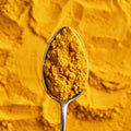 Spoonful of organic curry powder