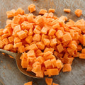 Pile of dehydrated organic diced carrots