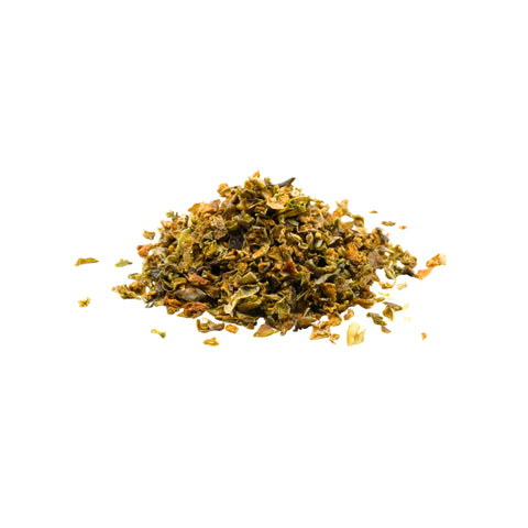 Organic diced green bell pepper on a white background