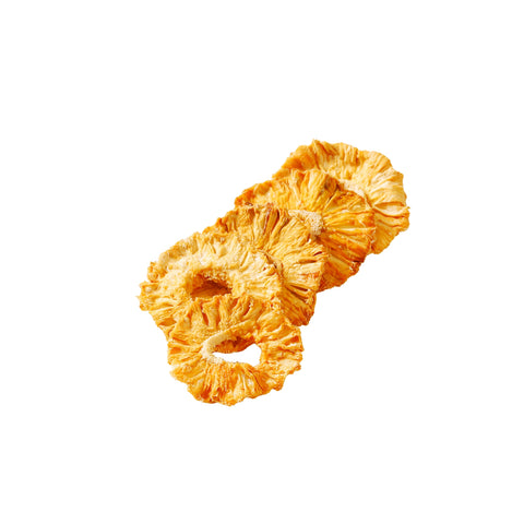 Golden organic dried pineapple rings on white background