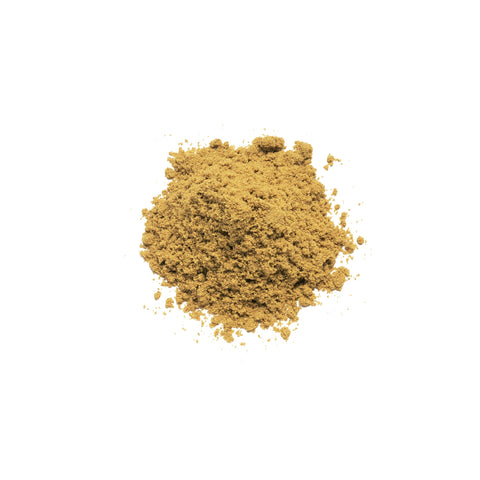 Organic ground cumin on a white background