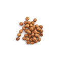 Pile of organic hazelnuts on a white background