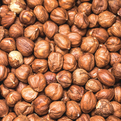 Organic hazelnuts stacked on top of each other