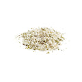 Organic crushed hemp seeds on white background