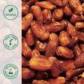 Close-up of organic honey dates on white background