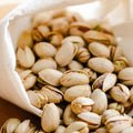 Pile of organic raw unsalted in-shell pistachios