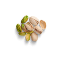 Organic raw unsalted in-shell pistachios on white background