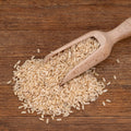 Scoop of organic long grain brown rice