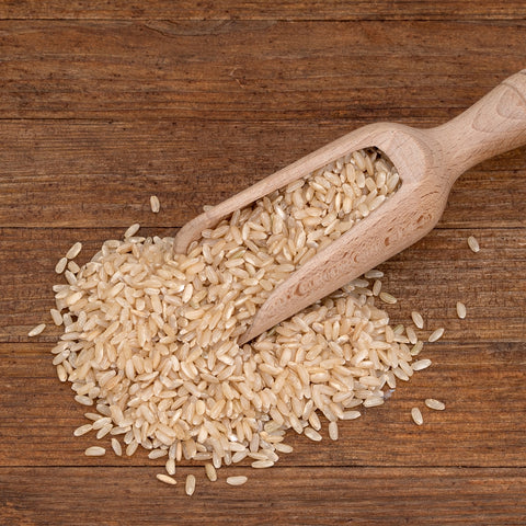 Scoop of organic long grain brown rice