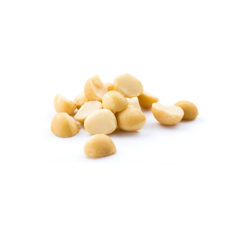 Raw organic macadamia nuts on white background
