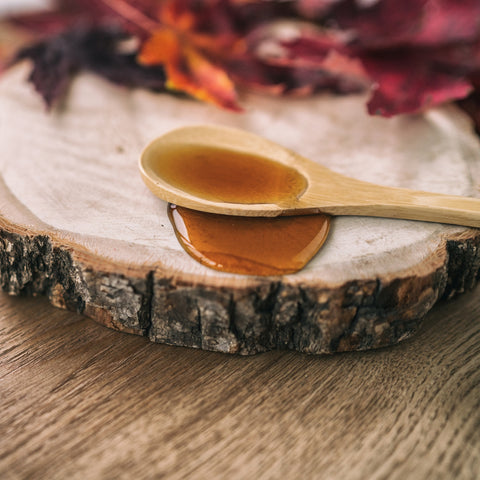 Organic maple syrup on a spoon
