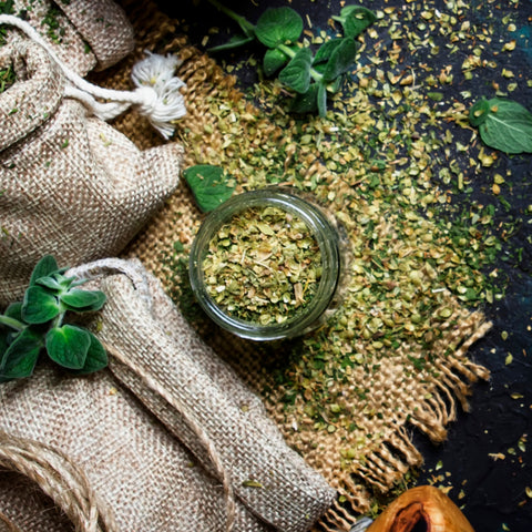 Jar of organic ground marjoram leaf