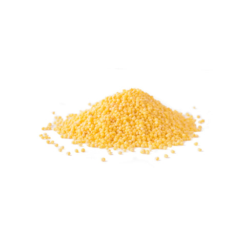 Organic hulled millet proso variety on white background