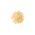 Organic minced garlic granules on a white background