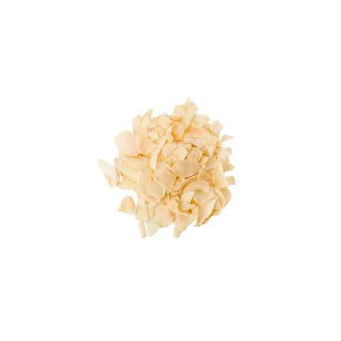 Organic minced garlic granules on a white background