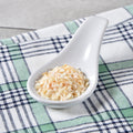 Spoonful of dried minced organic onion flakes