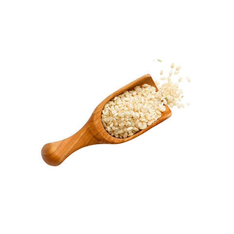 Organic sweet brown rice (mochi rice) on a white background