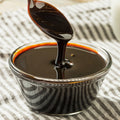 Bowl of organic blackstrap molasses