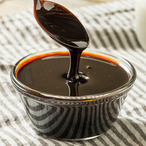 Bowl of organic blackstrap molasses