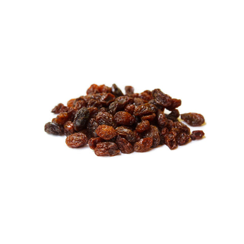 Organic monukka raisins on a white background