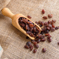 Scoop of organic monukka raisins