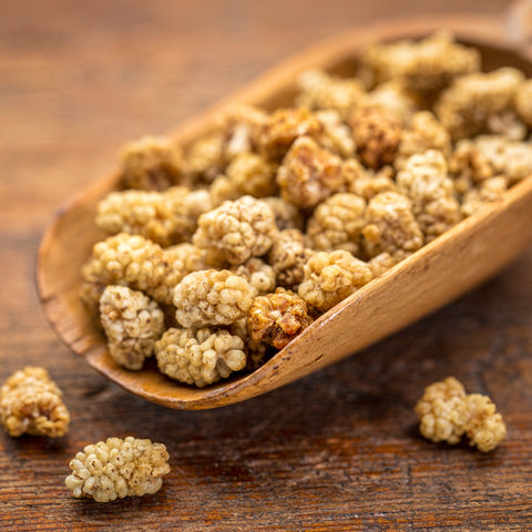Scoop of dried organic wild mulberries