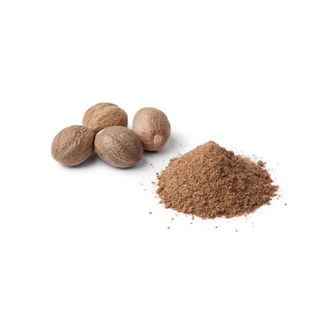 Organic ground nutmeg on a white background