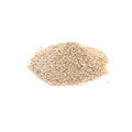 Pile of organic oat bran on a white background