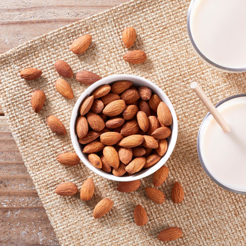 organic pastuerized almonds sitting in bowl on table