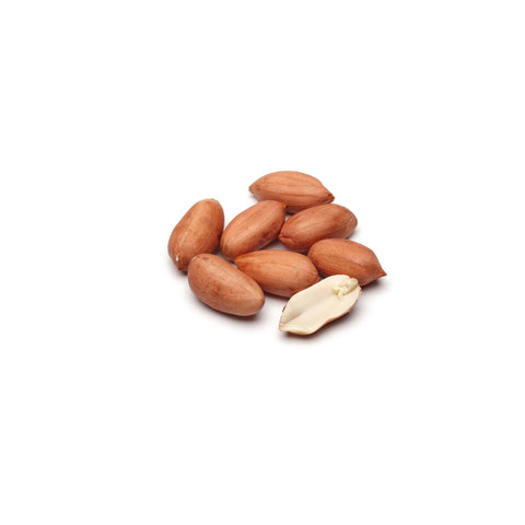 Raw organic red skin Spanish peanuts with skin on white background