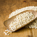 Scoop of organic pearled barley grains