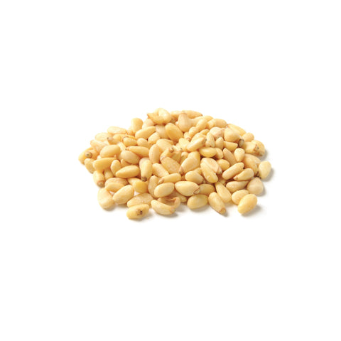 Raw organic pine nuts on a white background