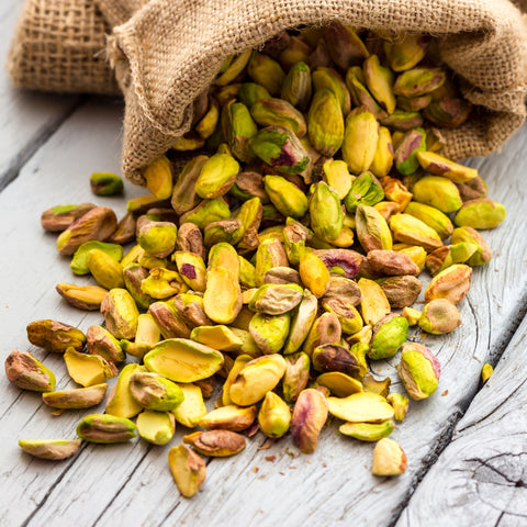 Bag full of organic raw pistachio meats unshelled