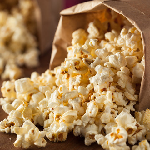 Bag of organic popcorn spilling out of bag