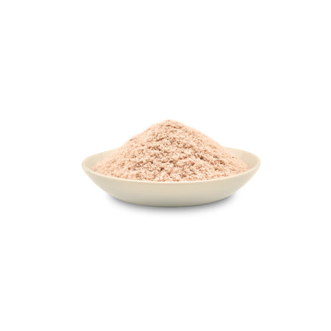 Organic psyllium seed husk in a bowl on a white background