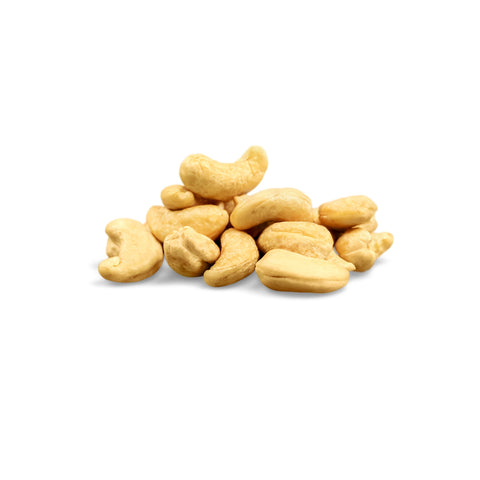 Pile of organic raw whole cashews on a white background