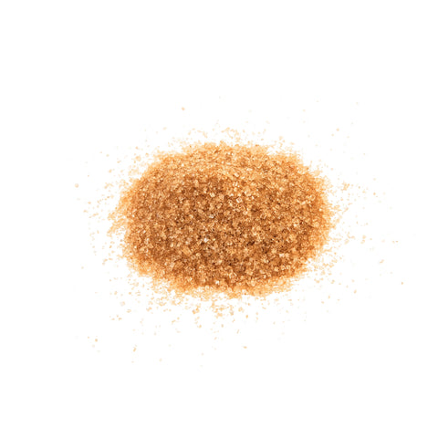 Organic raw sugar on a white background