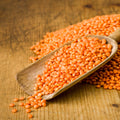 Scoop of organic red lentils without skin