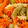 Close-up of cooked organic semolina 4-color spiral pasta