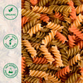 Close-up of uncooked organic semolina 4-color spiral pasta
